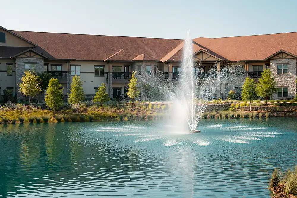 A water feature in the middle of a pond near The Villas apartments at Presbyterian Village North