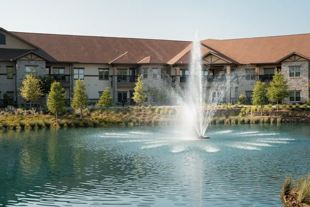 A distinctive fountain water feature in the middle of the lake at Presbyterian Village North