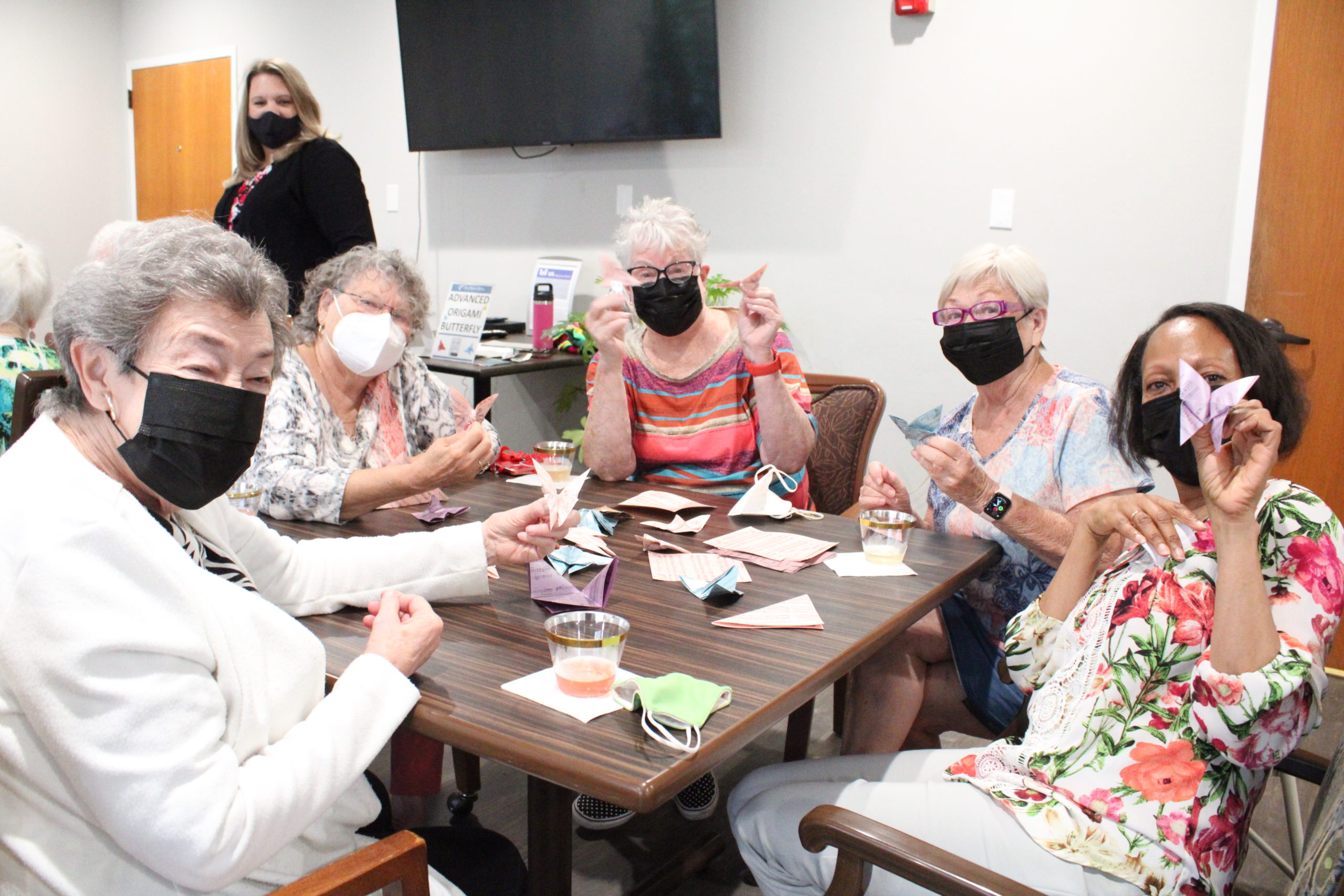 Independent Living and Assisted Living Residents Make Origami Butterflies for the Each Moment Matters Luncheon