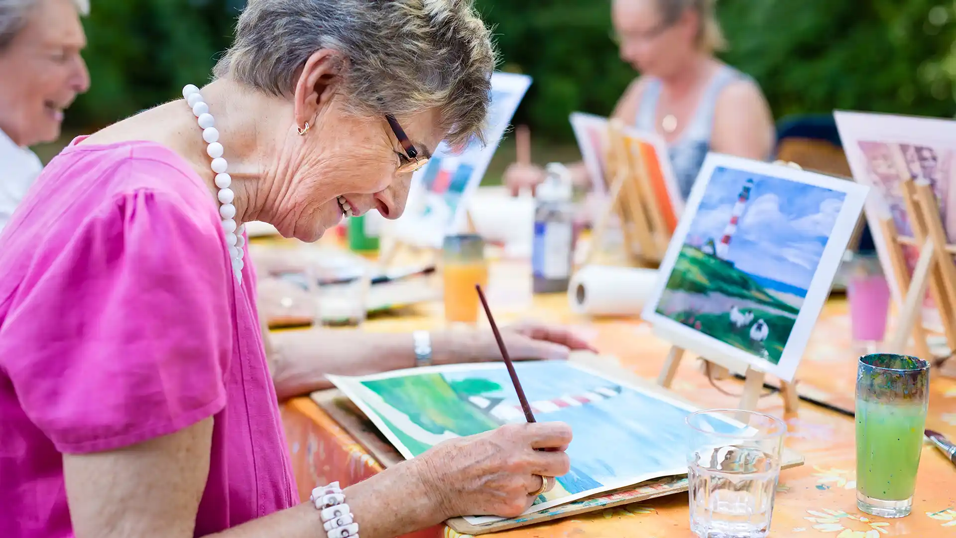 Group of women painting outdoors