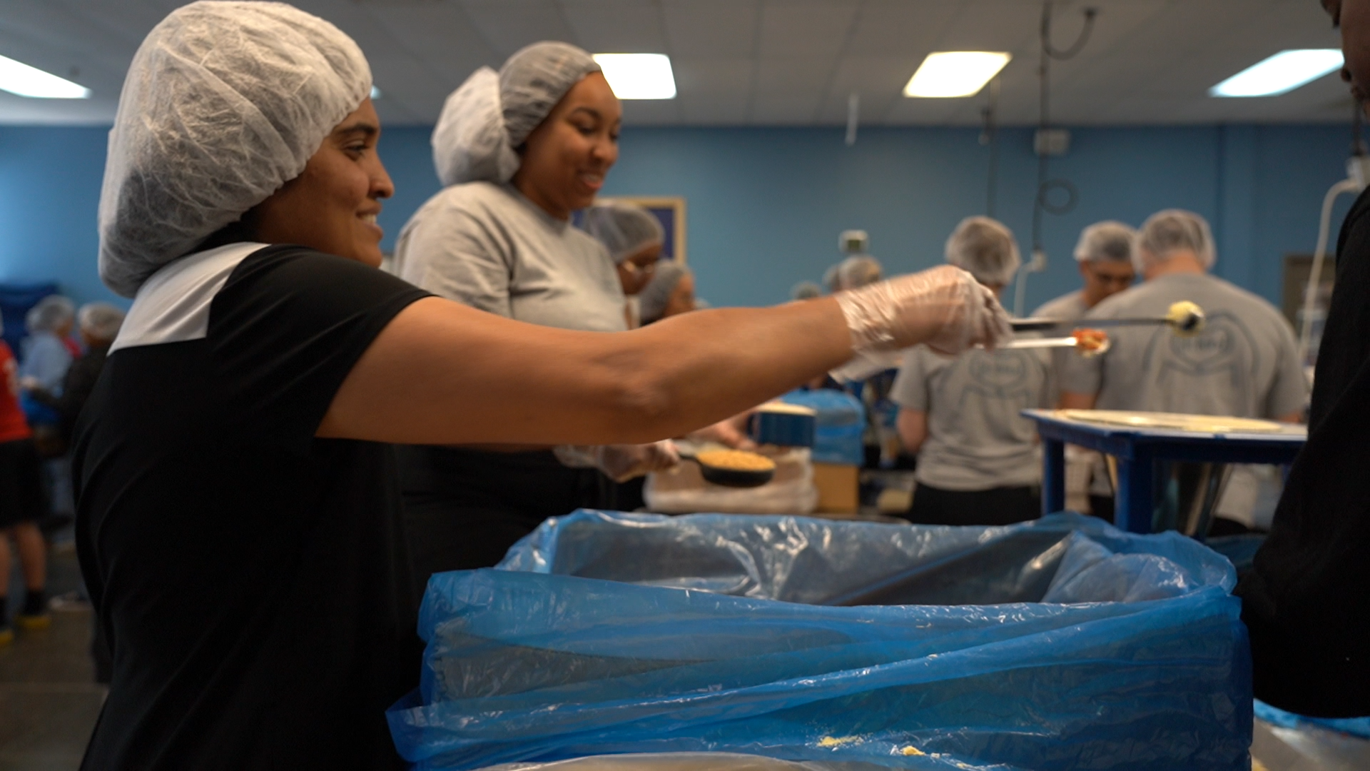 PVN Therapy team volunteers to pack food for children