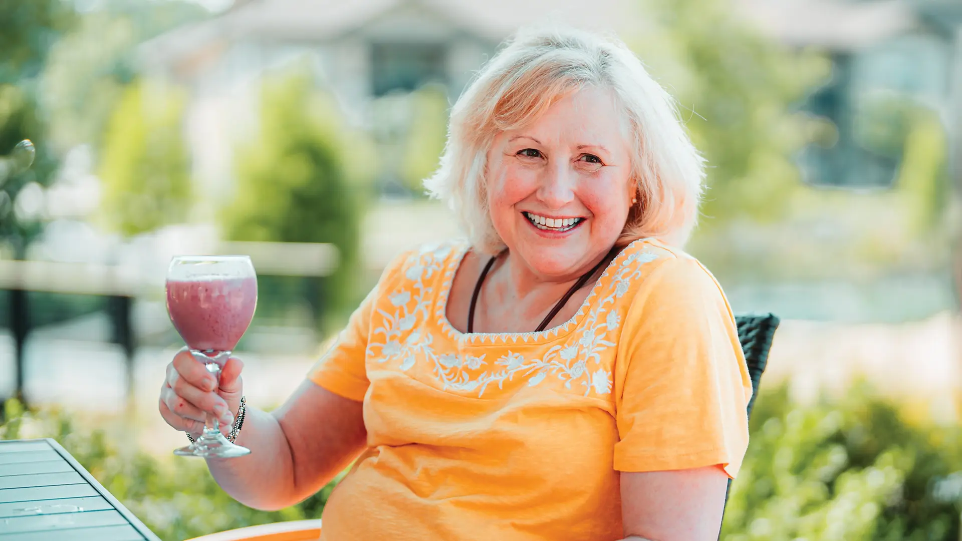 PVN resident enjoying a drink with some friends outside